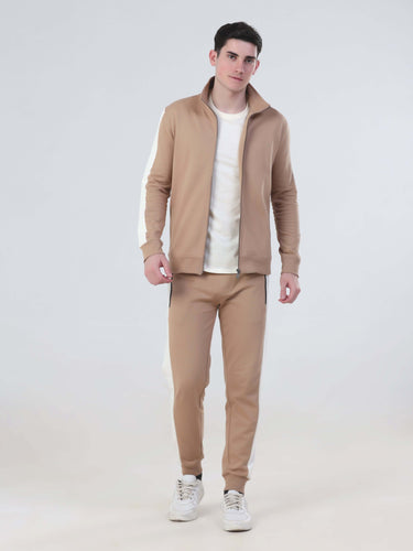 Man wearing the Sandy Heaven Turms Intelligent Cord Set in tan, featuring waterproof, anti-odour fabric in a stylish co-ord set.