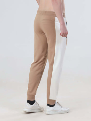 Men's beige and white joggers from the Sandy Heaven collection, featuring a sporty design and comfortable fit.