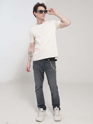 Man wearing Soft Peach Turms T-shirt with anti-stain and anti-odor properties, tailored fit, and stretchable fabric, perfect for trending intelligent apparel