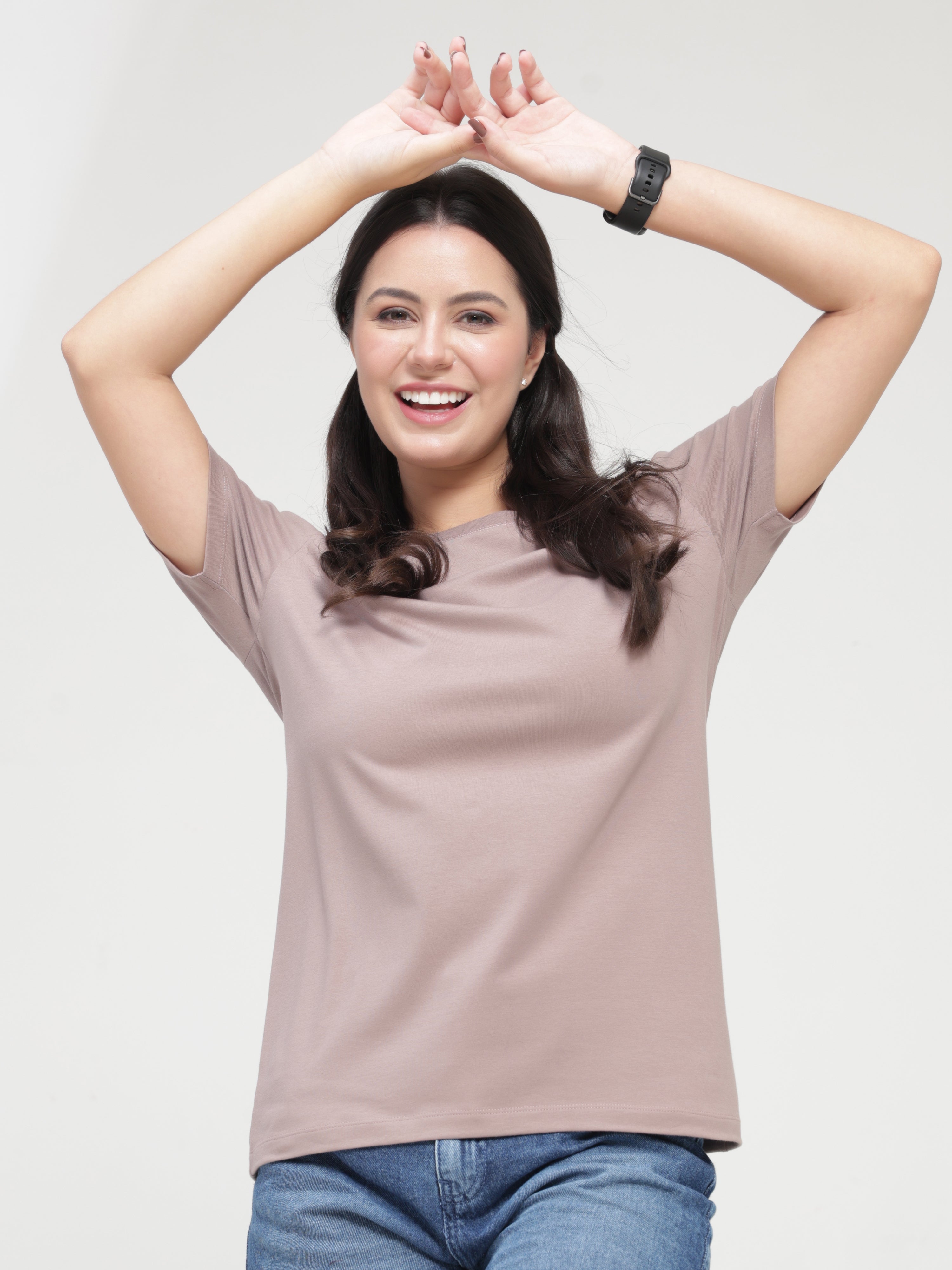 Woman wearing Dusky Maroon round-neck Turms T-shirt, anti-stain and anti-odour, stretchable intelligent apparel.