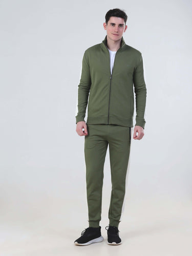 Man wearing a water-resistant olive green co ord set, featuring a zip-up jacket and joggers, ideal for stylish comfort.