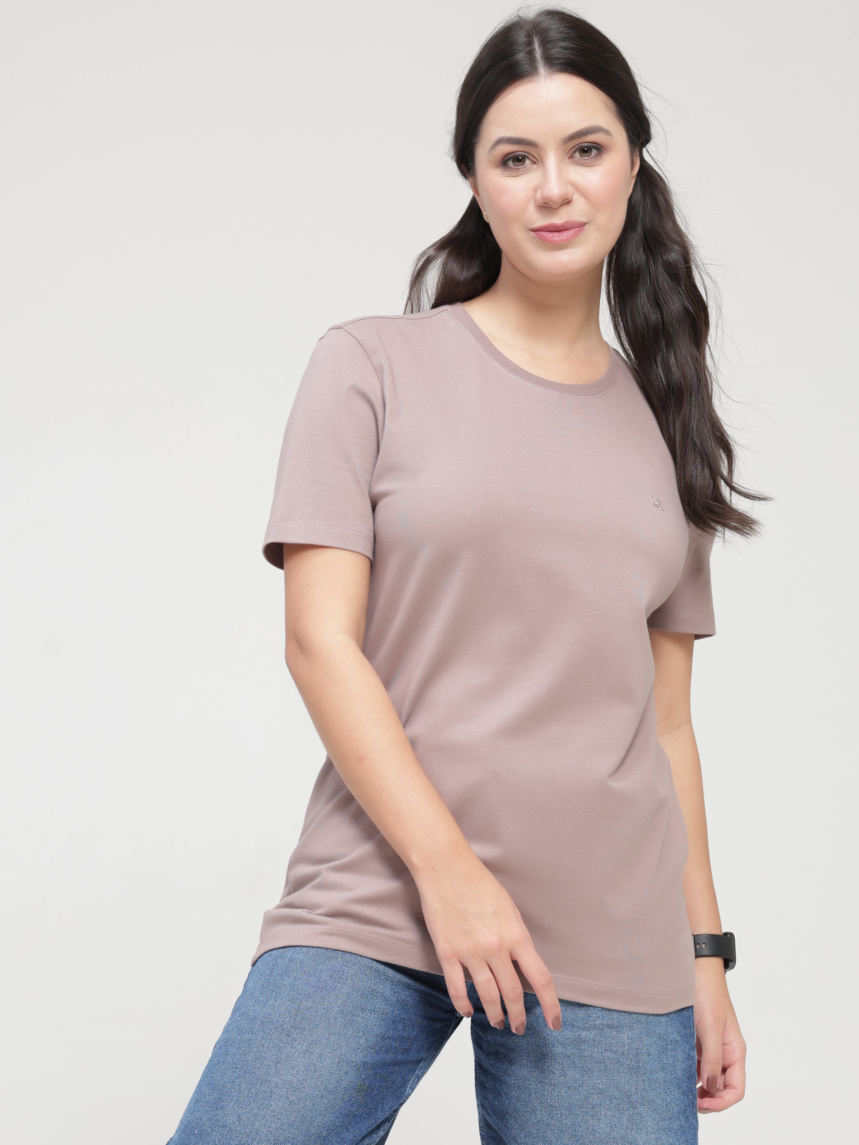 Woman wearing a Dusky Maroon round-neck Turms T-shirt with tailored fit, anti-stain, anti-odour, stretchable fabric, and trending intelligent apparel.