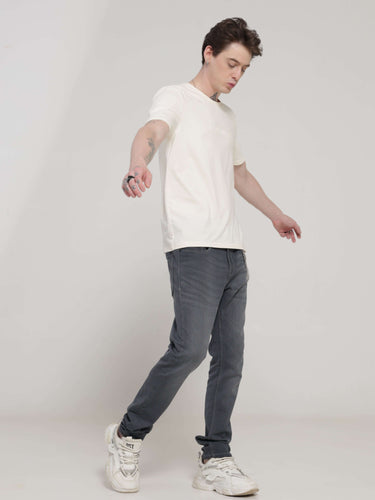 Man wearing a Soft Peach round-neck Turms T-shirt with stretchable, anti-stain, and anti-odour properties, perfect for trending intelligent apparel.