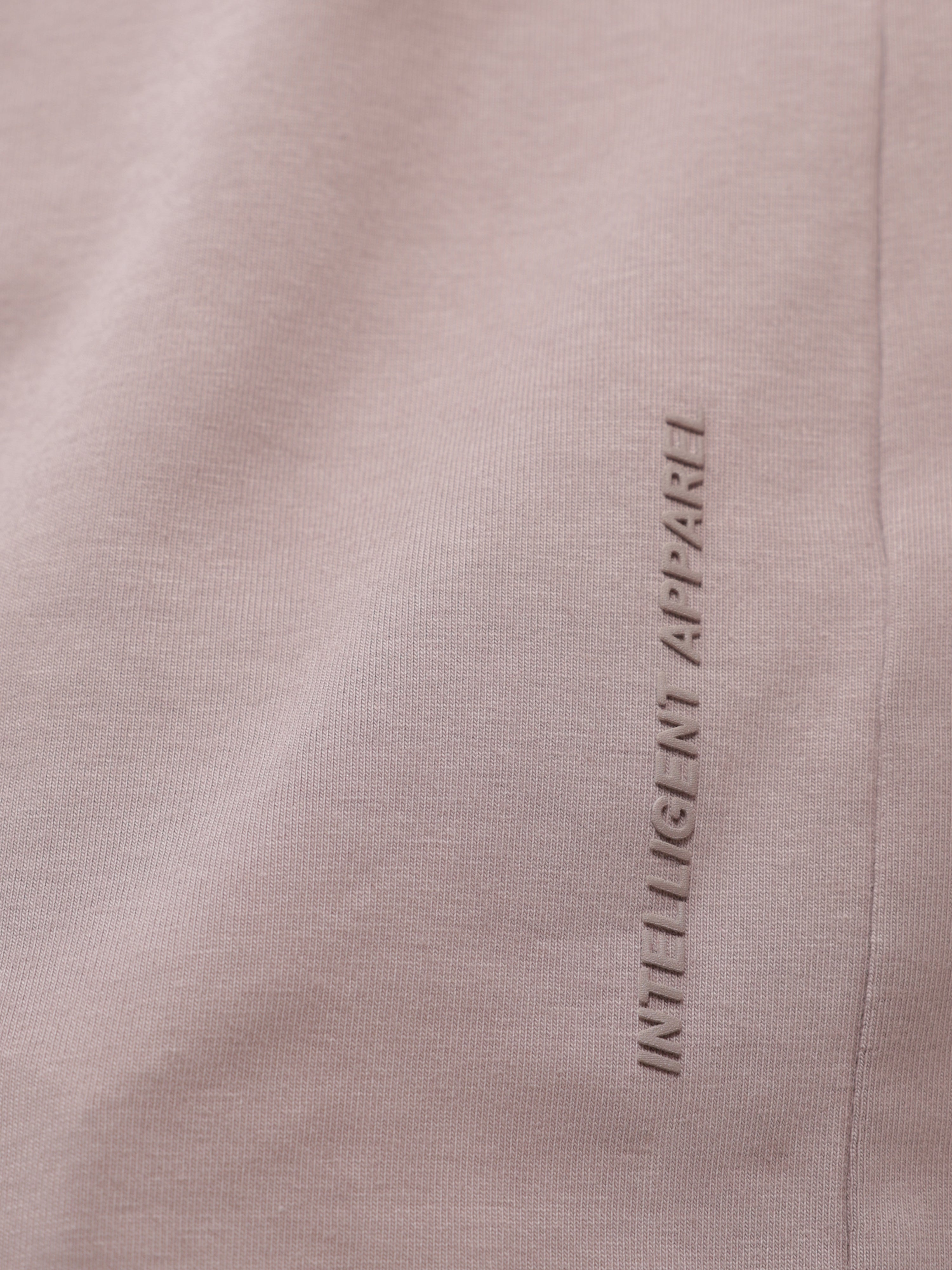 Close-up of Dusky Maroon stain-proof and odor-resistant round-neck Turms T-shirt with "INTELLIGENT APPAREL" text.