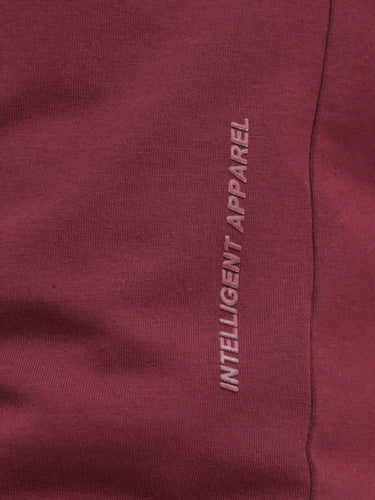 Burgundy Elite Turms T-shirt with "Intelligent Apparel" text, showcasing anti-stain, anti-odor, and stretchable fabric. Ideal for women’s trending fashion.