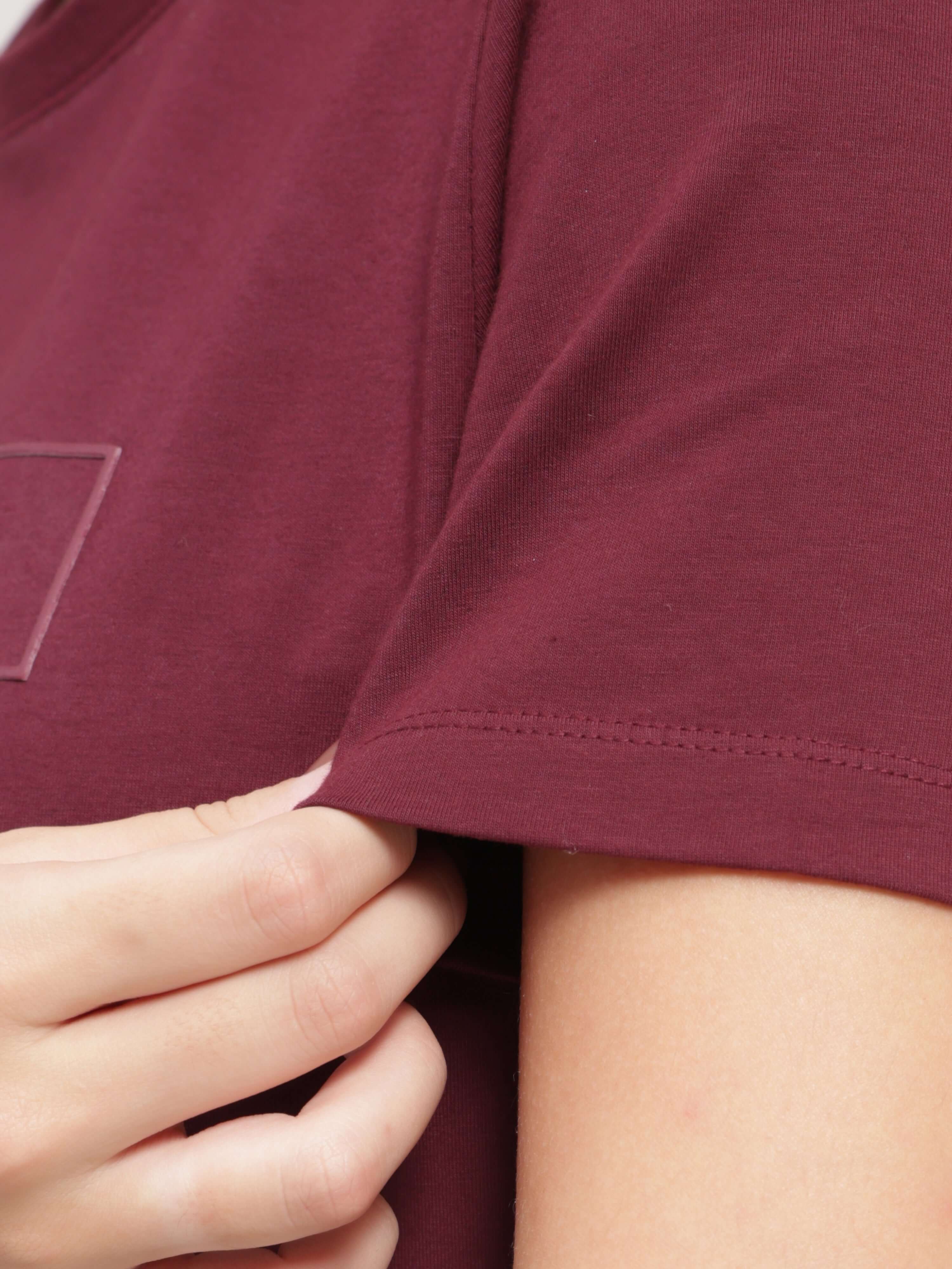 Close-up of Burgundy Elite Turms T-shirt sleeve, anti-stain, anti-odour, stretchable, intelligent apparel for women, tailored fit, premium cotton