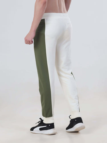 Back view of unisex water-resistant joggers in white and olive green, part of the Turms Intelligent Apparel co-ord set.