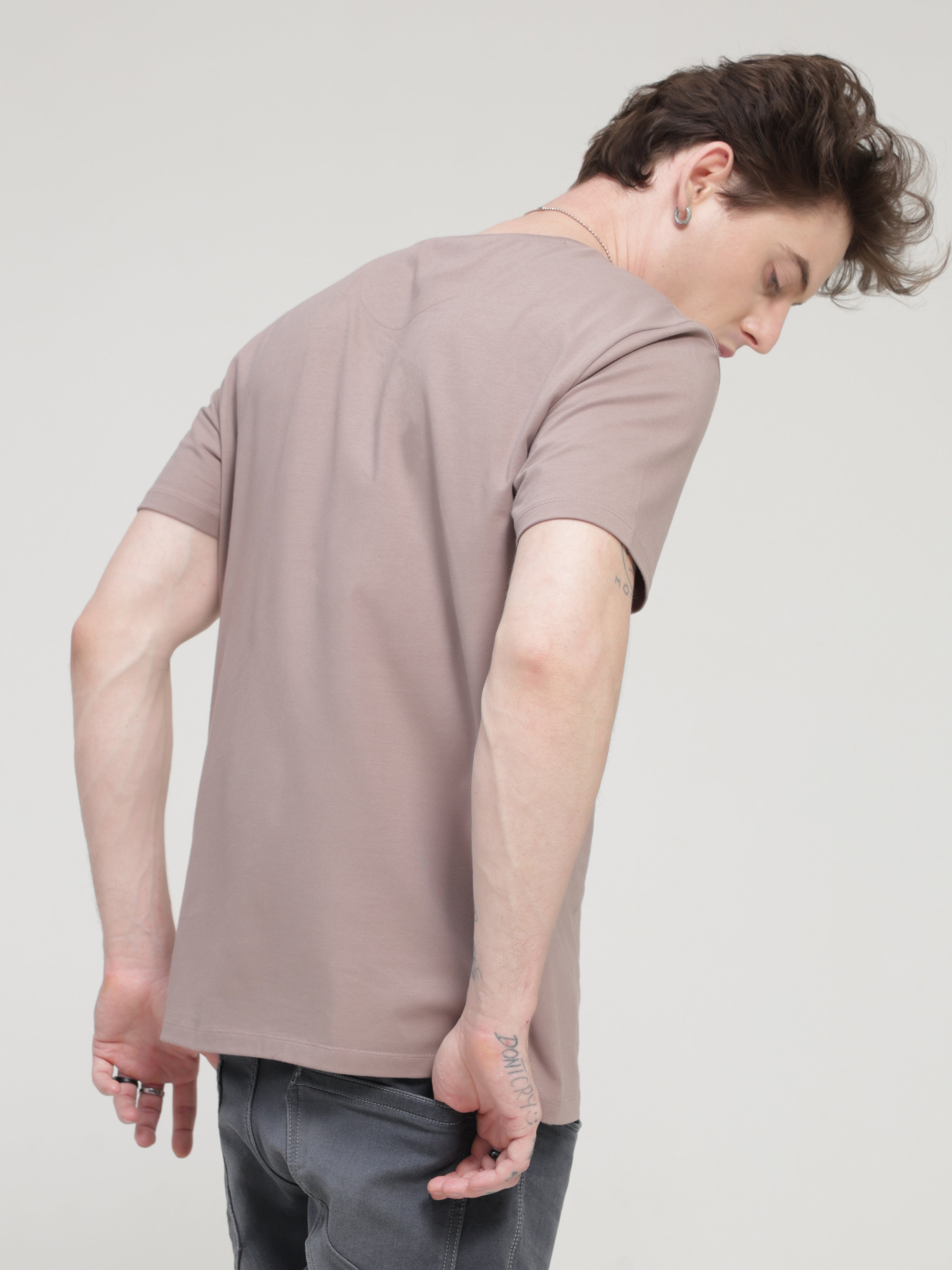 Man wearing Dusky Maroon round-neck Turms T-shirt, stain-proof and odor-resistant, tailored fit, 95% cotton, 5% spandex, stylish and trendy.