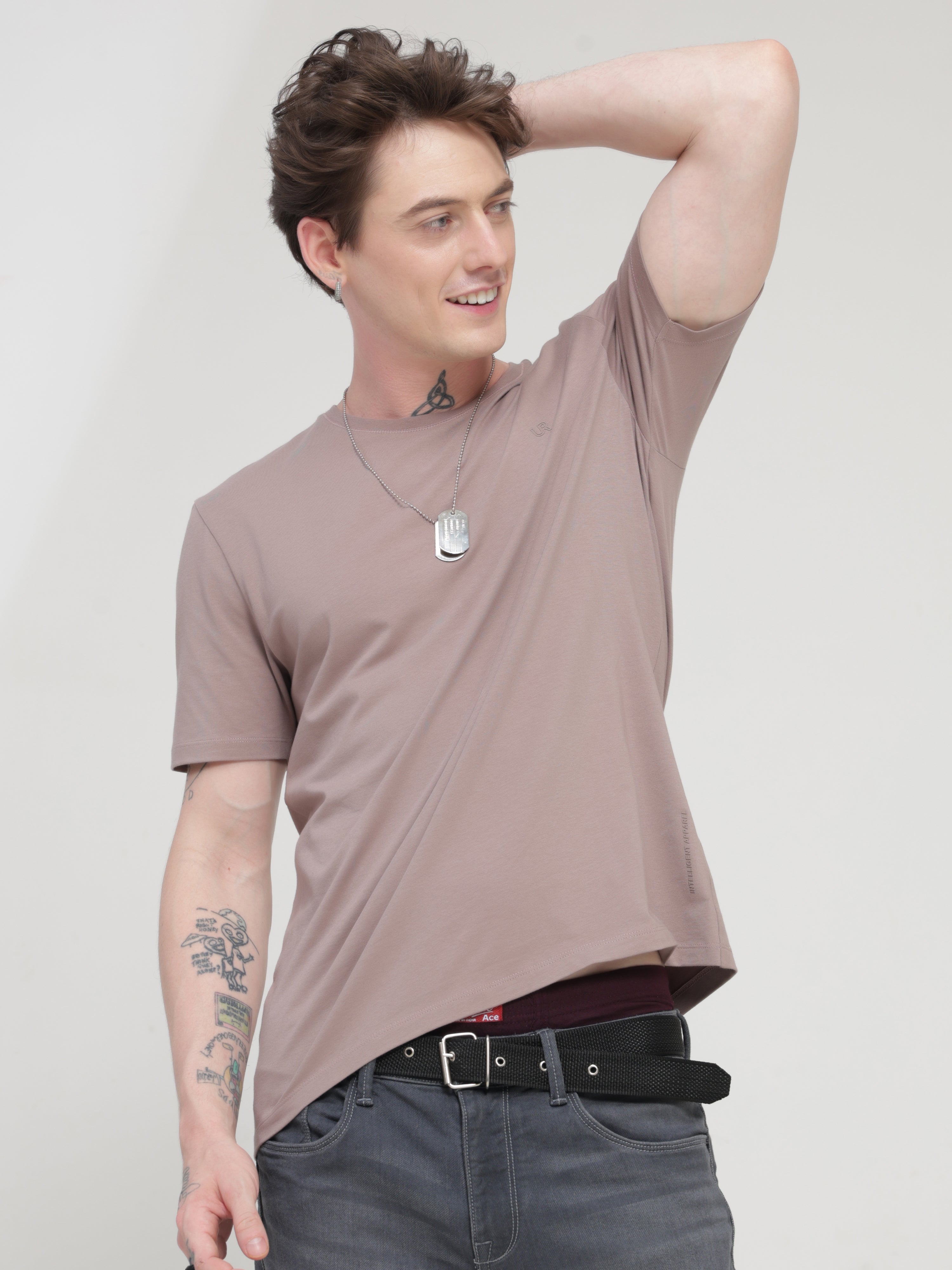 Man wearing Dusky Maroon round neck t-shirt, showcasing stylish and stain-proof design for men - trending, branded and best tshirts online.