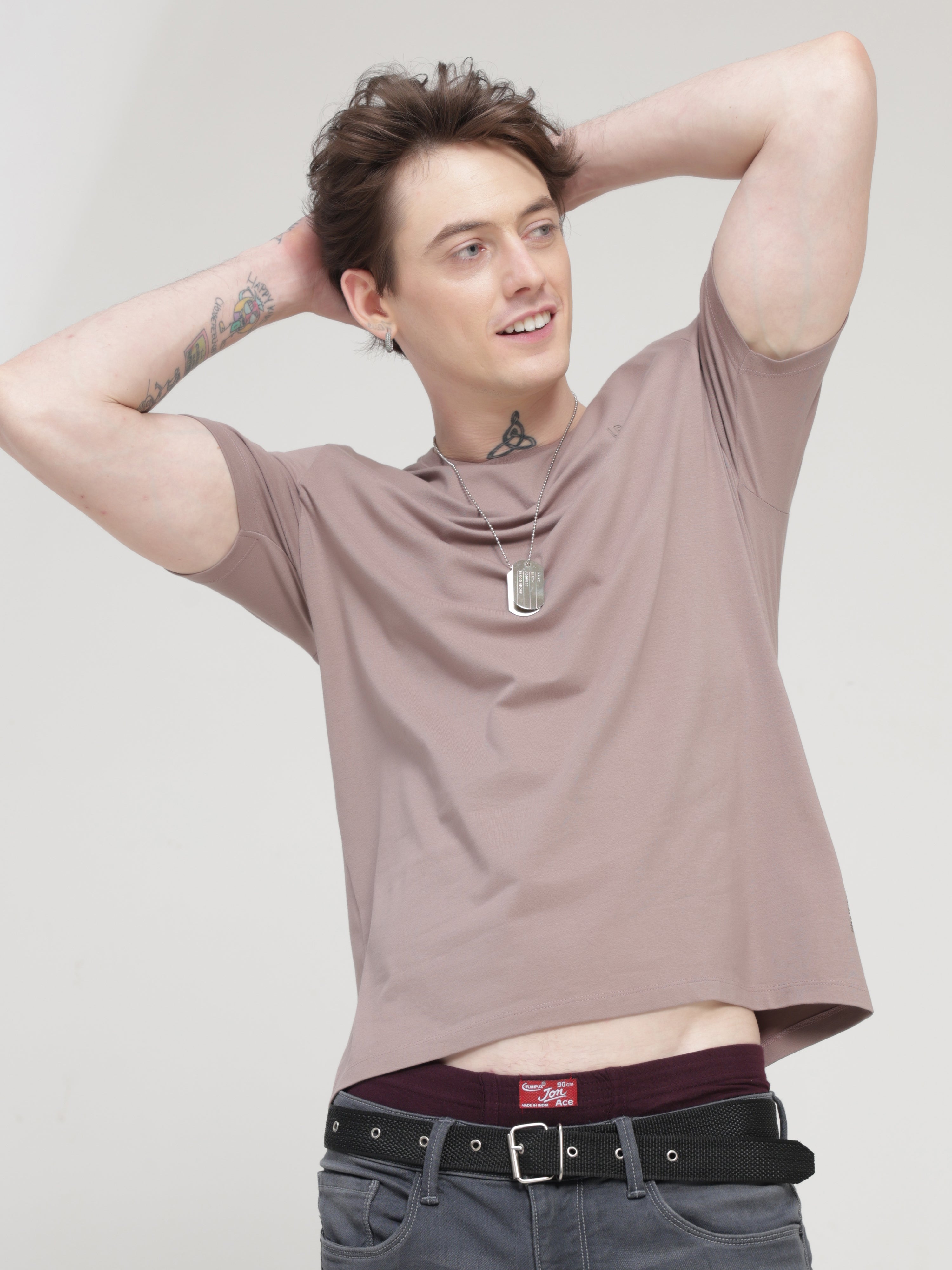 Man wearing Dusky Maroon round-neck Turms T-shirt, stylish and trendy, tailored fit, premium cotton, stain-proof and odor-resistant.