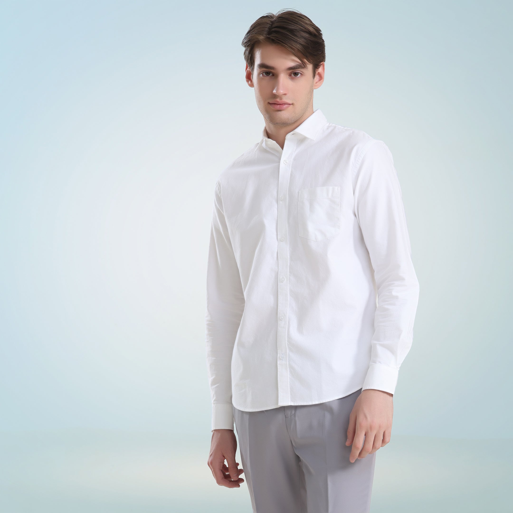 Man wearing Moonlite White Turms Oxford shirt made from premium super combed cotton, featuring anti-stain and anti-odour technology.