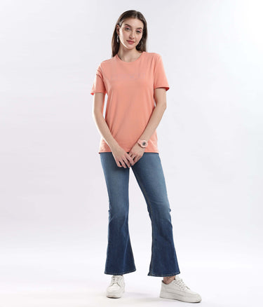 Model wearing Womens casual t-shirt Ember Orange cotton tshirt with stretchable, waterproof, and anti-odour features.