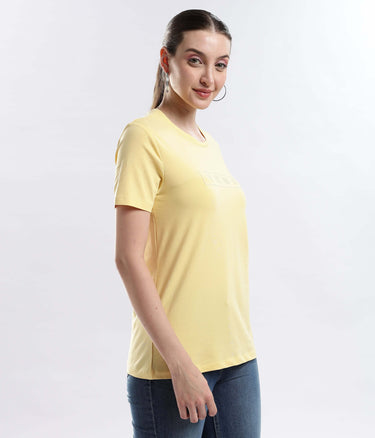 Model wearing the Womens casual t-shirt Aura Yellow cotton t-shirt, showcasing its stylish design and comfort.