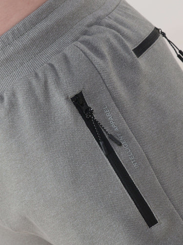 Grey Turms Intelligent Jogger showcasing waterproof, anti-stain features with sleek design and secure zip pockets.