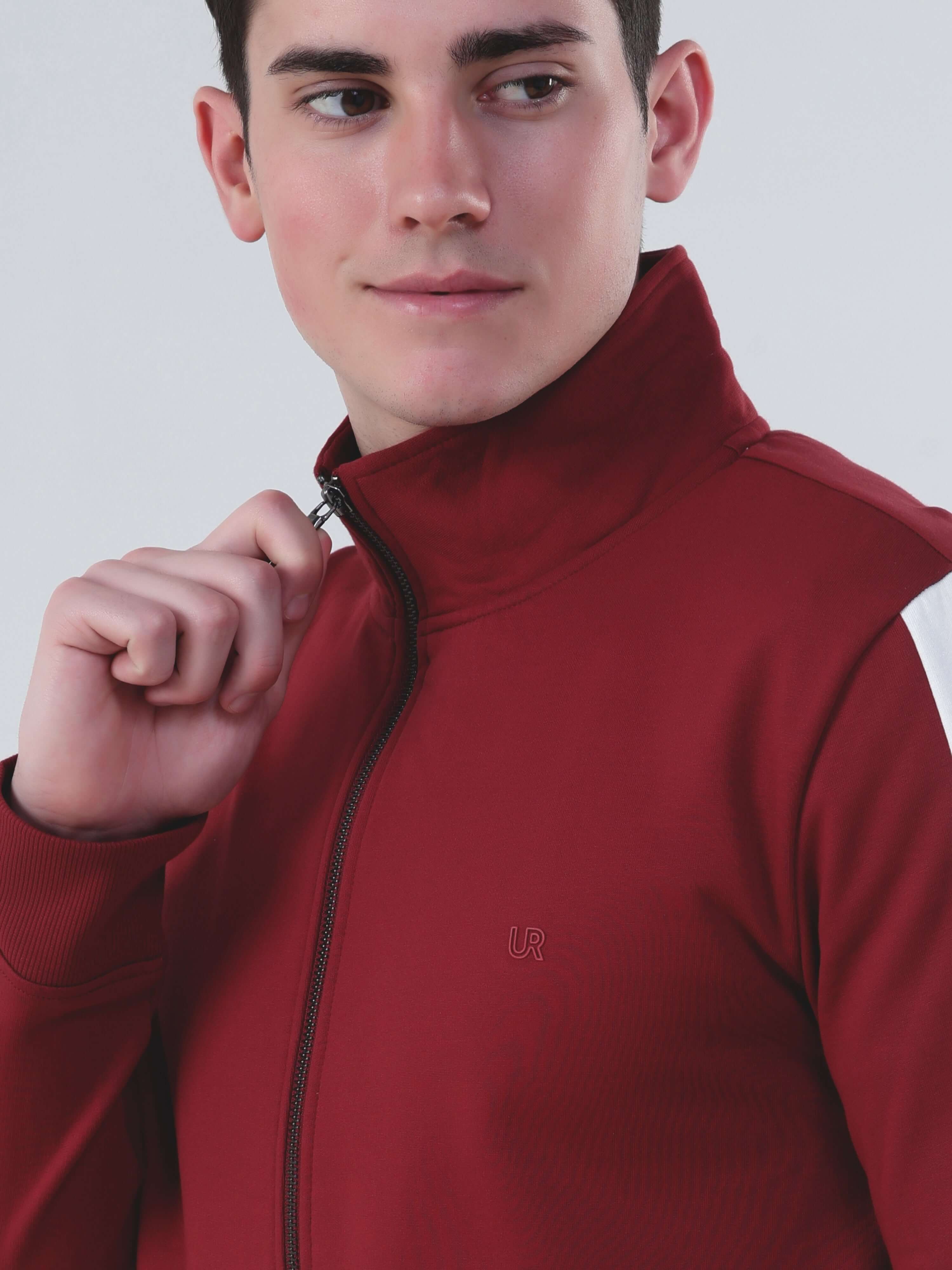 Model showcasing Turms Intelligent waterproof red jacket with brass zipper, a stylish co-ord set for men and women.