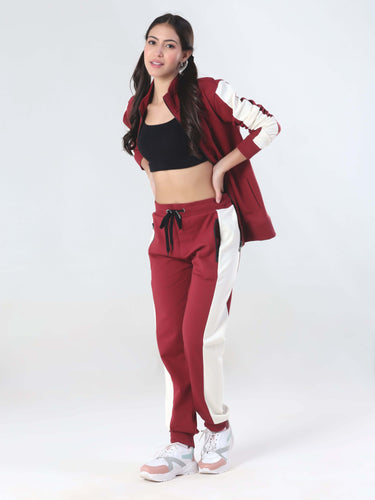 Stylish woman in a red and white coord set, featuring turms anti-stain, waterproof, and anti-odour joggers.