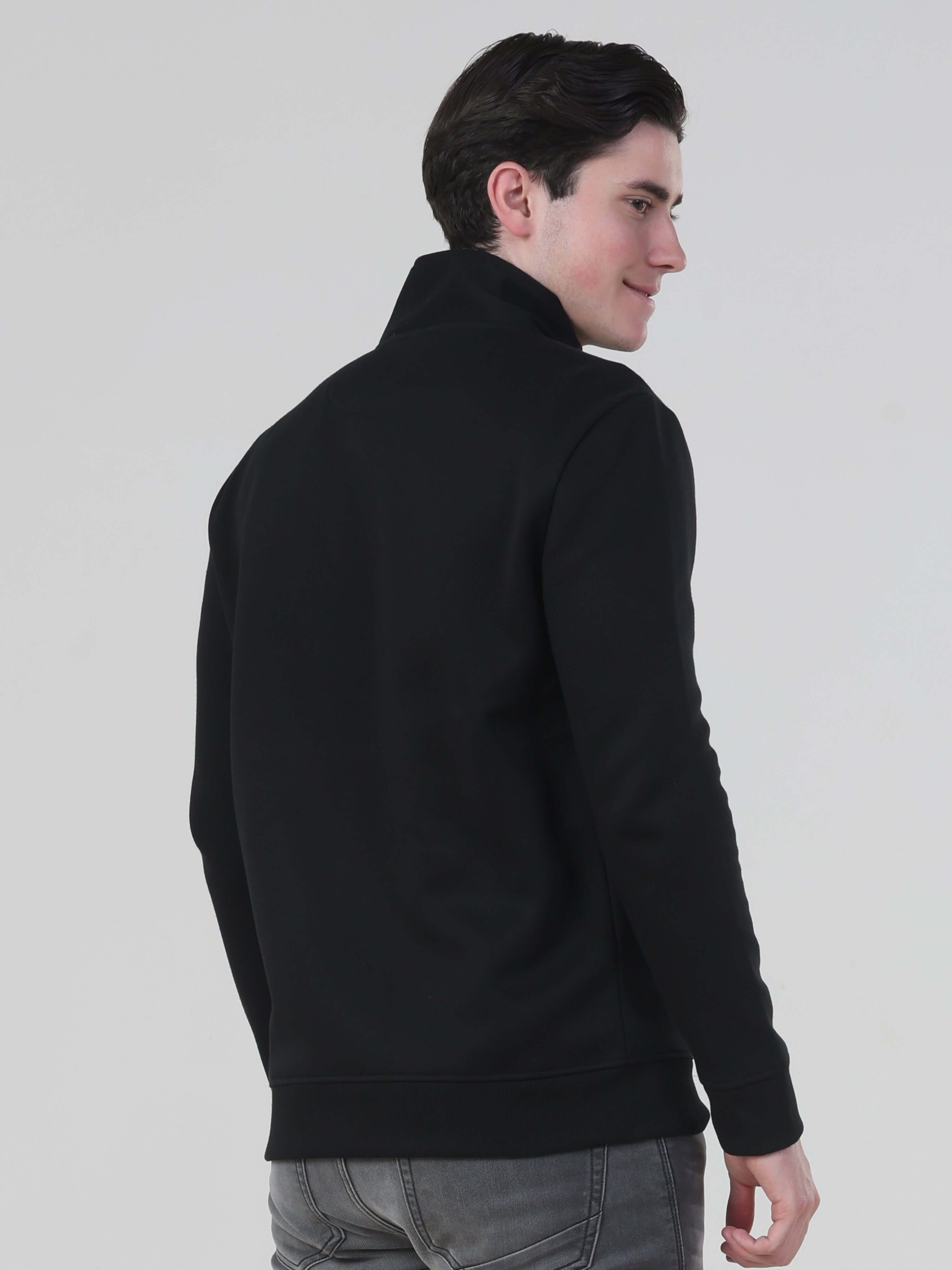 Back view of a man wearing the Turms Intelligent Traveller Jacket, showcasing its sleek design and comfortable fit.