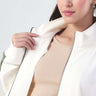 Woman wearing Turms Intelligent Cord Set, showcasing stylish soft jacket and breathable anti-odour ribbed top.