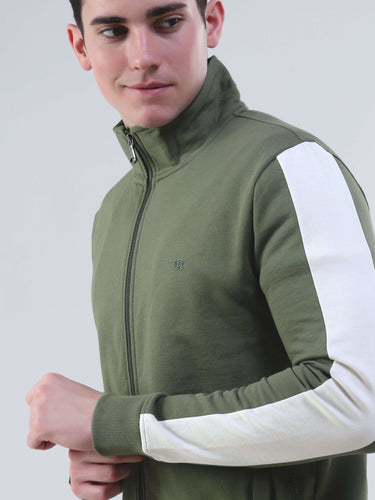 Stylish man wearing a green and white co-ord set jacket, featuring a zip and a sporty design, ideal for everyday wear.