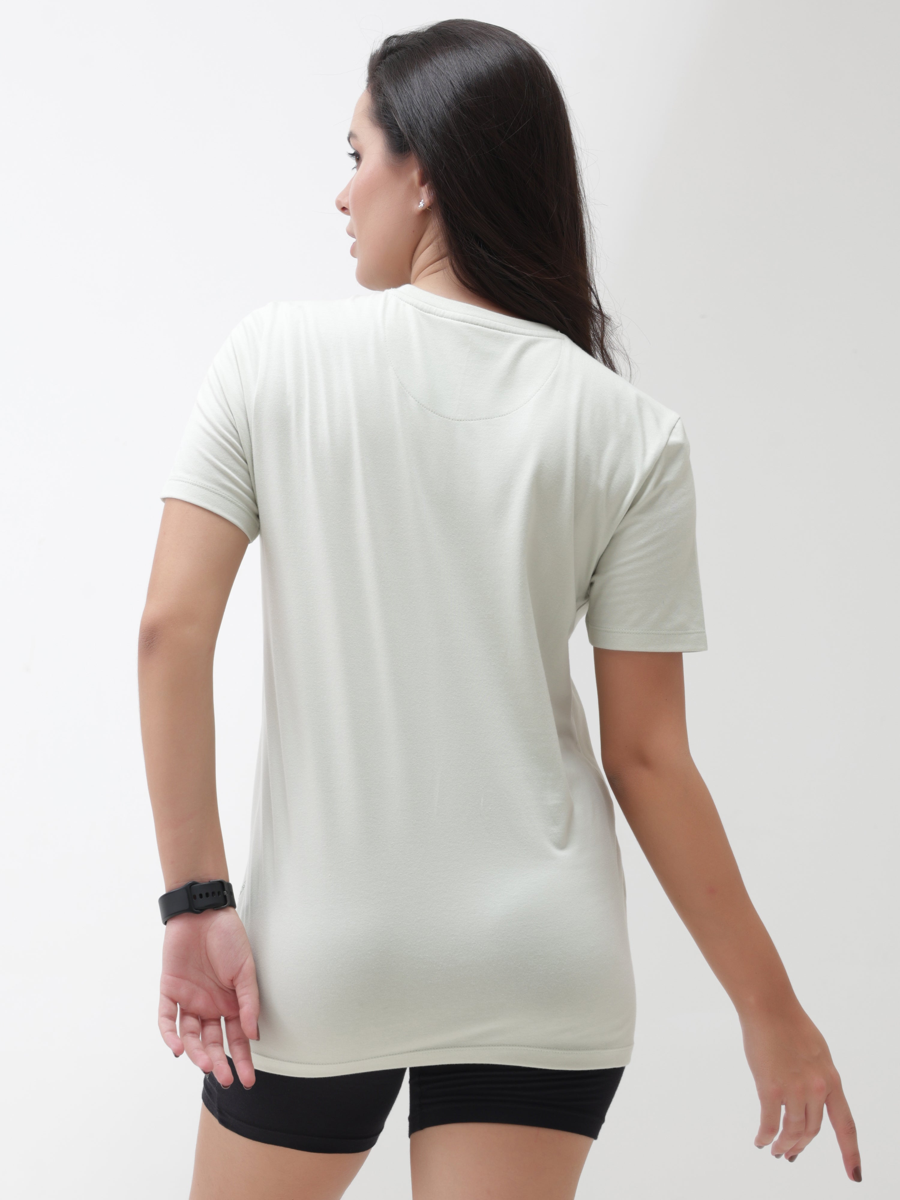 Back view of woman wearing lime enigma anti-stain, anti-odor, stretchable, Turms intelligent apparel T-shirt with tailored fit and round neck.
