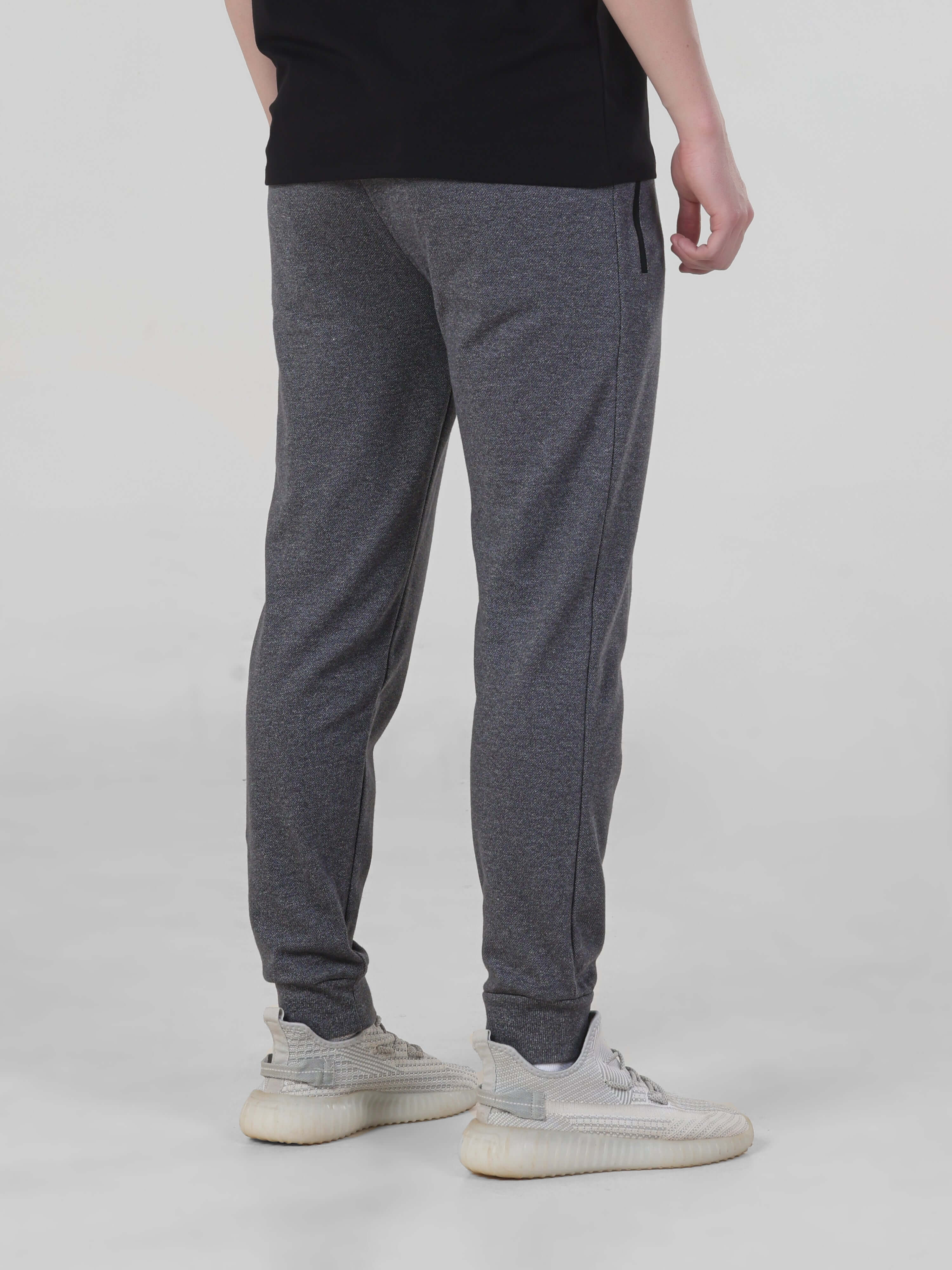 Turms charcoal mens jogger, waterproof, anti-stain, anti-odor, stylish stretchable design for travelers.