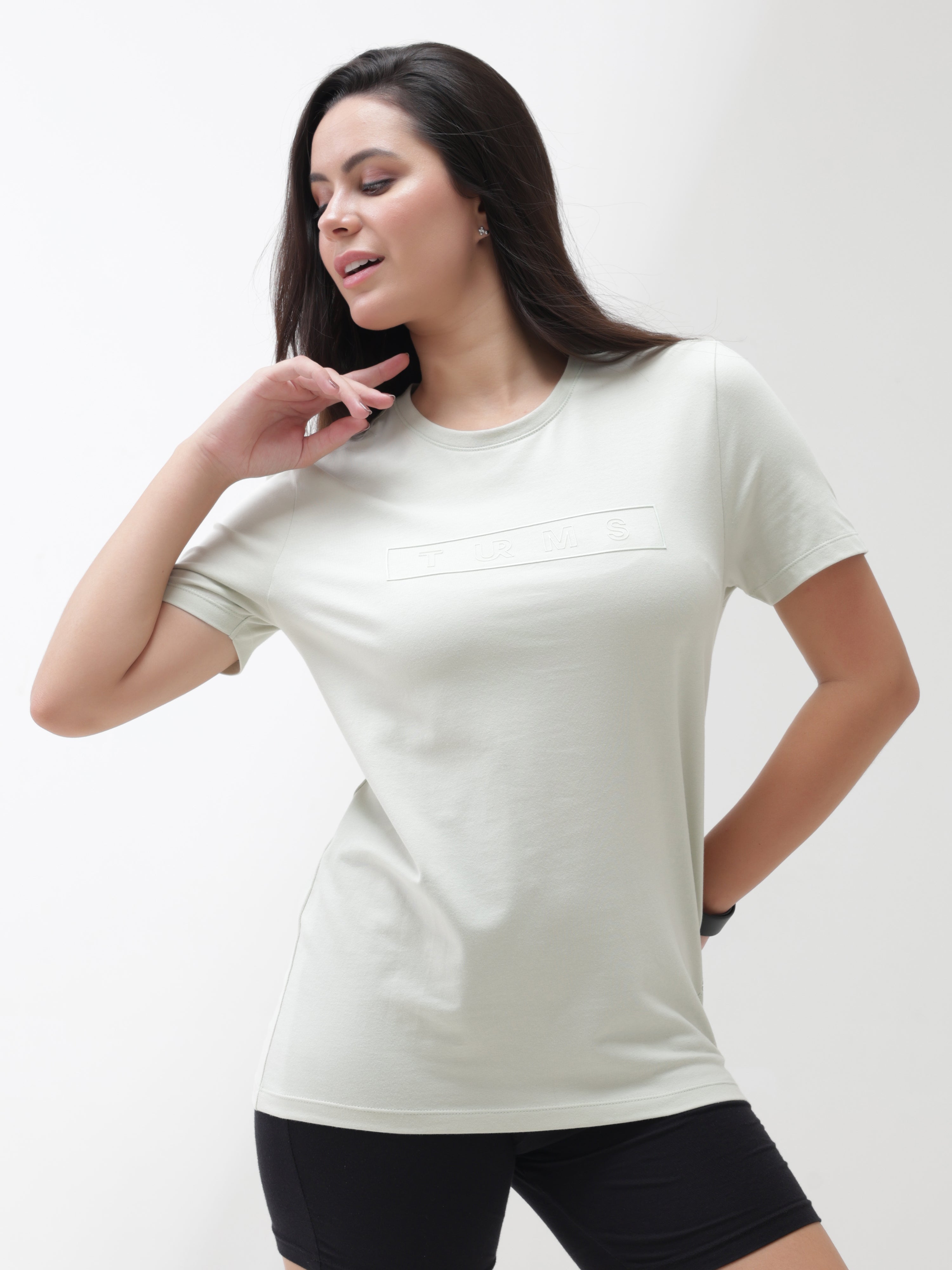 Woman wearing Lime Enigma Turms T-shirt with anti-stain, anti-odour, and stretchable intelligent apparel features, tailored fit, and crew neckline.