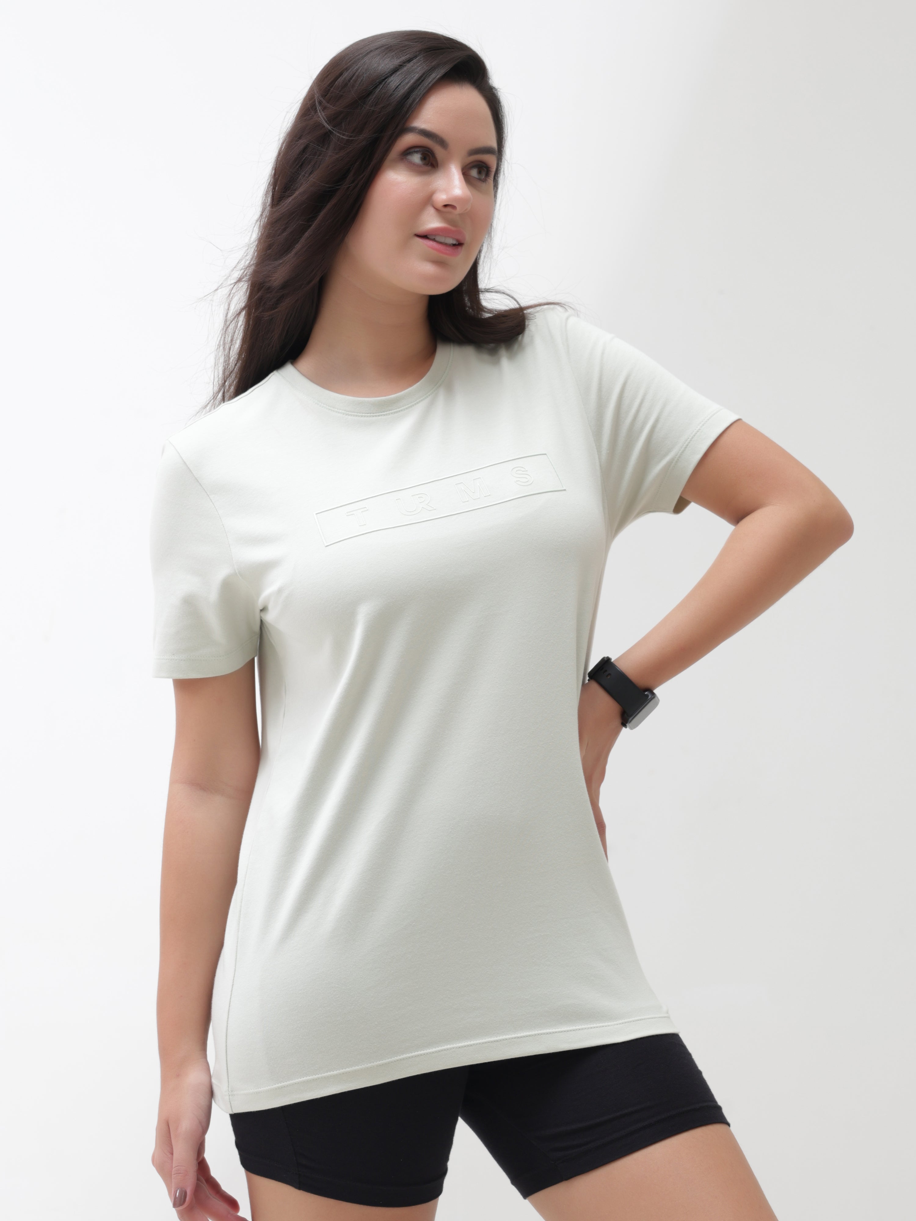 Woman wearing Lime Enigma stain-proof, anti-odor Turms T-shirt. Stretchable, tailored fit, premium cotton-spandex blend. Intelligent apparel.