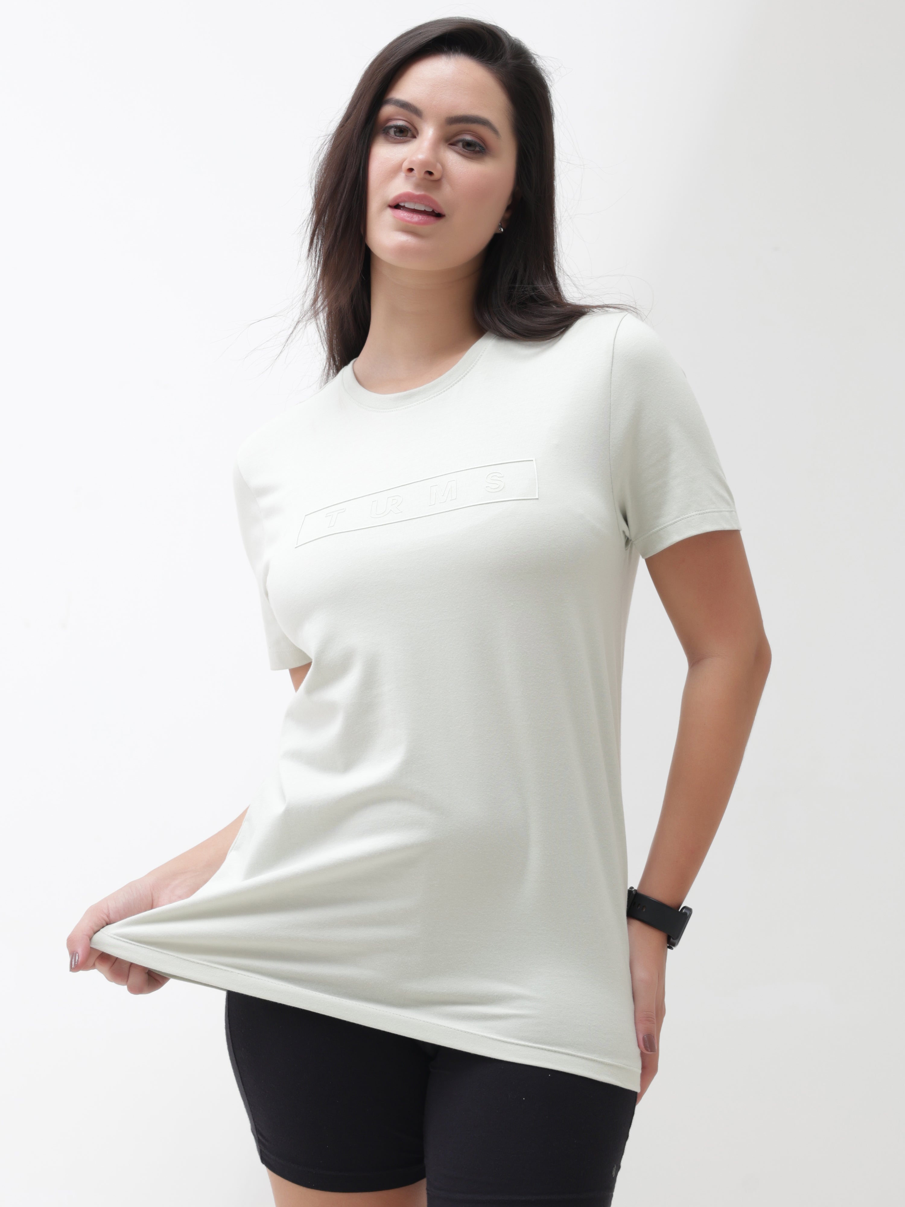 Woman wearing Lime Enigma round-neck Turms T-shirt, showcasing its stretchable and tailored fit, anti-stain, and anti-odor intelligent apparel.