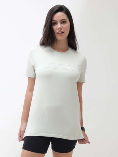Woman wearing a tailored fit, round neck, lime Enigma Turms T-shirt that is anti-stain, anti-odor, stretchable, intelligent apparel.