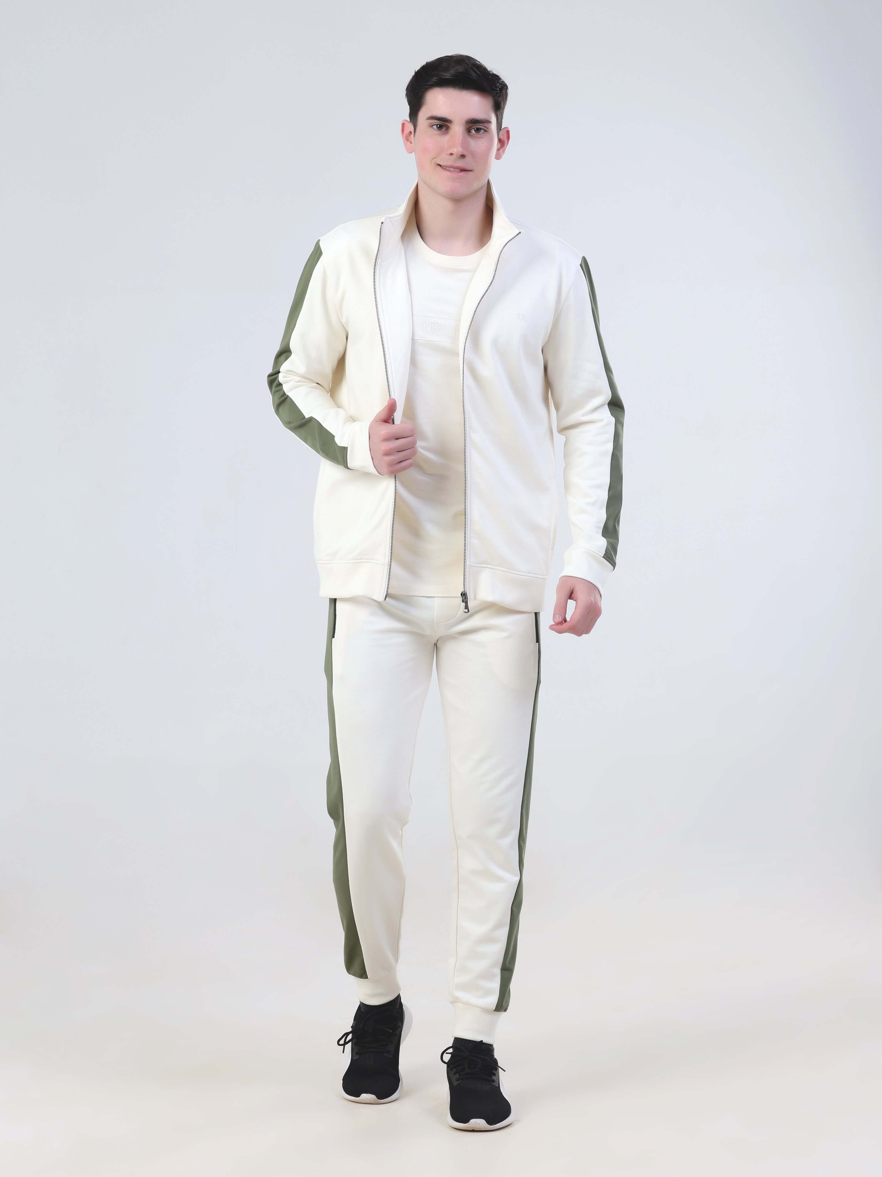 Man in desert snow co-ord set, featuring water-resistant jacket and joggers, showcasing Turms Intelligent Apparel style.