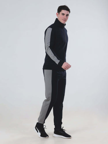 Model wearing a stylish blue and gray co-ord set, showcasing the Turms Intelligent apparel collection for men.