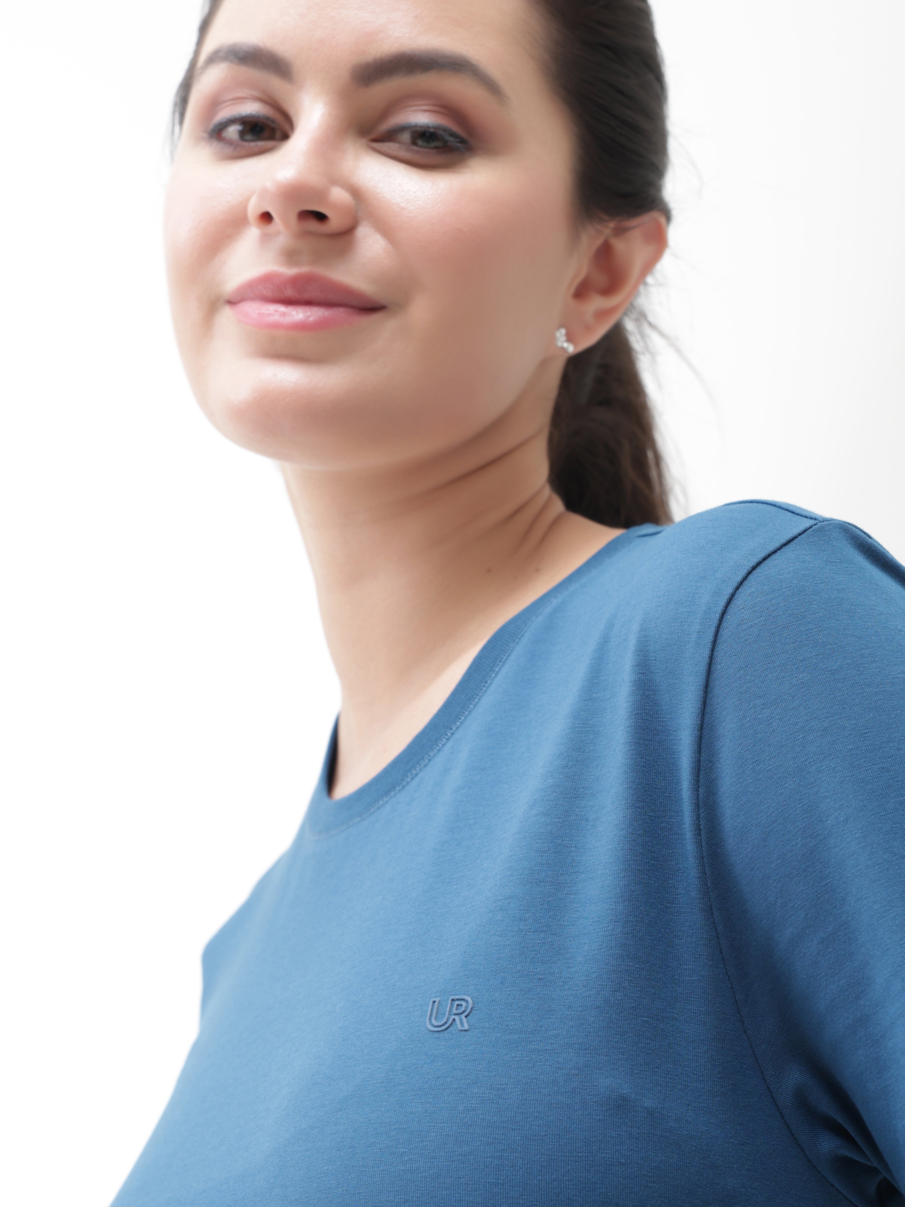 Woman wearing Sea Blue Turms T-shirt, anti-stain and anti-odour, tailored fit with crew neckline, made from premium cotton and spandex blend.