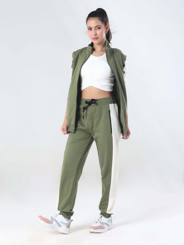 Women in Turms winter forest coord set, featuring waterproof joggers and jacket for stylish travel wear.