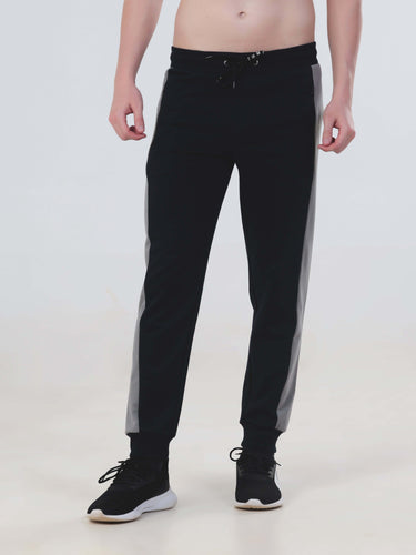 Men's black joggers with grey side panels, stylish, waterproof, and anti-odour for a sporty look.