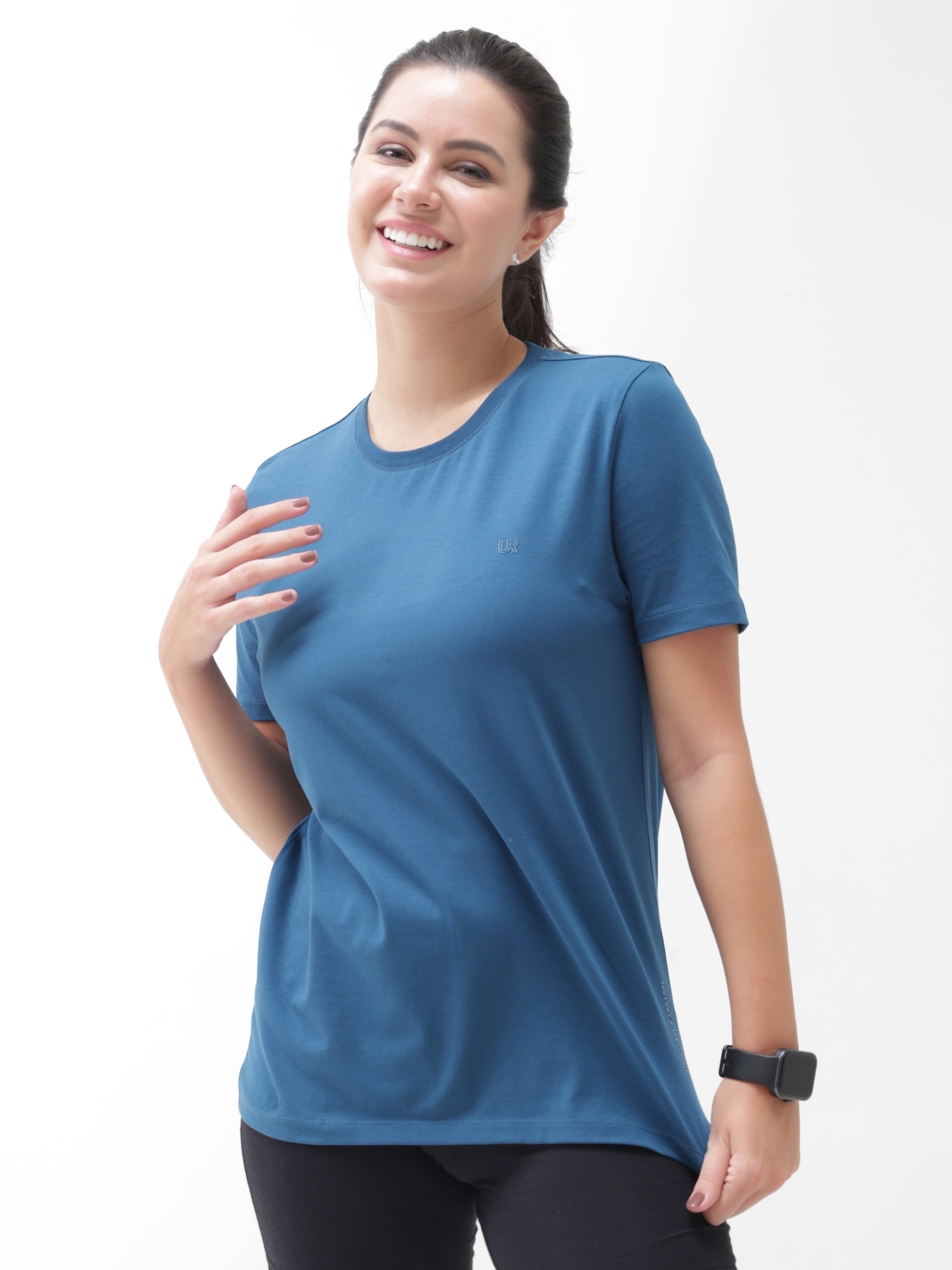 Woman wearing Sea Blue anti-stain, anti-odour, stretchable Turms T-shirt with tailored fit and round neckline from intelligent apparel collection.