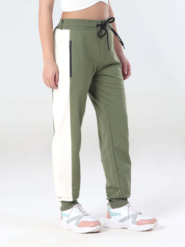 Turms women's joggers in green with white side panel, perfect for travel and casual wear, featuring a stylish design and comfort.