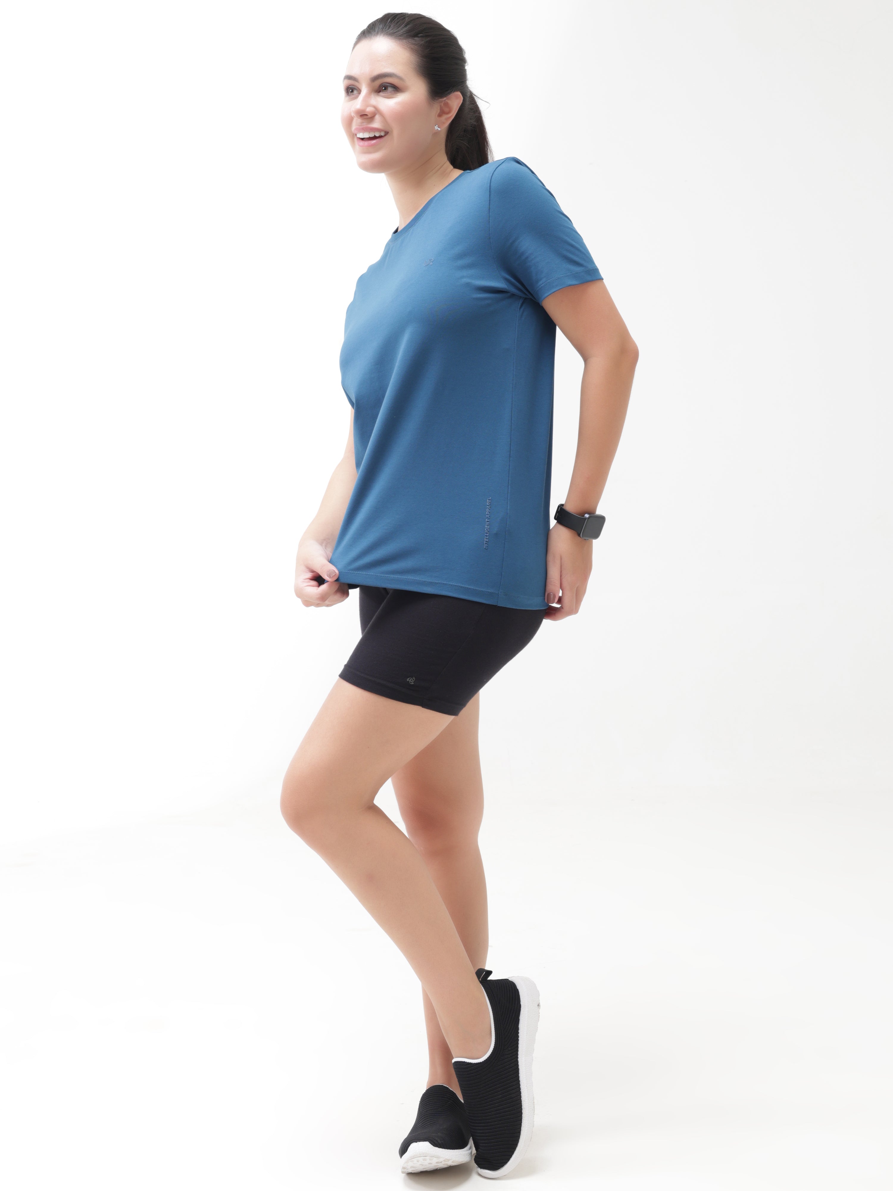 Woman wearing Sea Blue anti-stain, anti-odour Turms T-shirt with tailored fit, stretchable, and crew neck; best intelligent apparel trend
