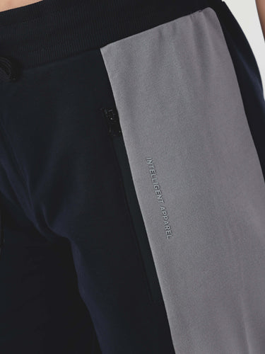 Close-up of Turms Women's joggers featuring intelligent apparel branding, showcasing a stylish and functional design.