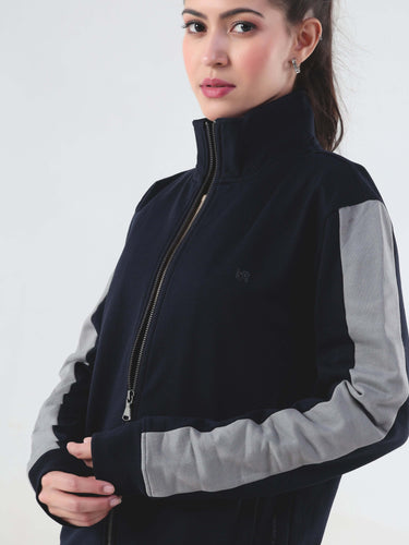 Model wearing Turms Intelligent Cord Set jacket in navy and gray, showcasing its sporty style and premium cotton-blend fabric.