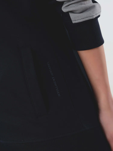 Close-up of Turms Intelligent Cord Set jacket pocket featuring anti-odour and waterproof technology for women.