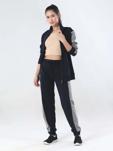 Woman wearing Turms Intelligent Coord Set in navy and gray, featuring waterproof and anti-odour joggers.