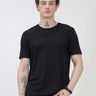 Man wearing black round-neck Turms T-shirt, tailored fit, anti-stain, anti-odor, stretchable intelligent apparel. Trending and best in fashion.