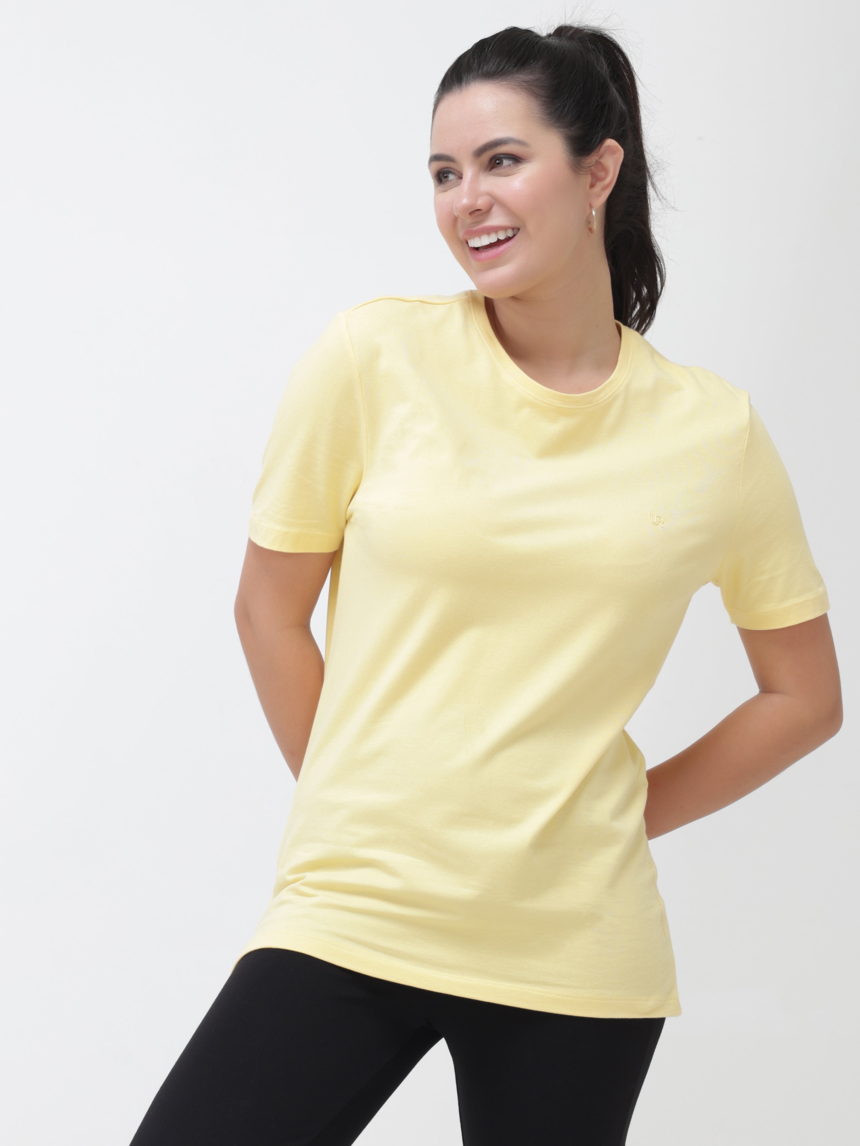 Woman wearing yellow round-neck Turms T-shirt, stain-proof and odor-resistant, tailored fit, stylish and best for casual wear.