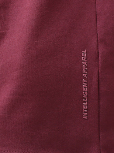 Burgundy Elite, stain-proof, odor-resistant Turms T-shirt fabric showing "Intelligent Apparel" text, round-neck, stretchable, anti-odor.
