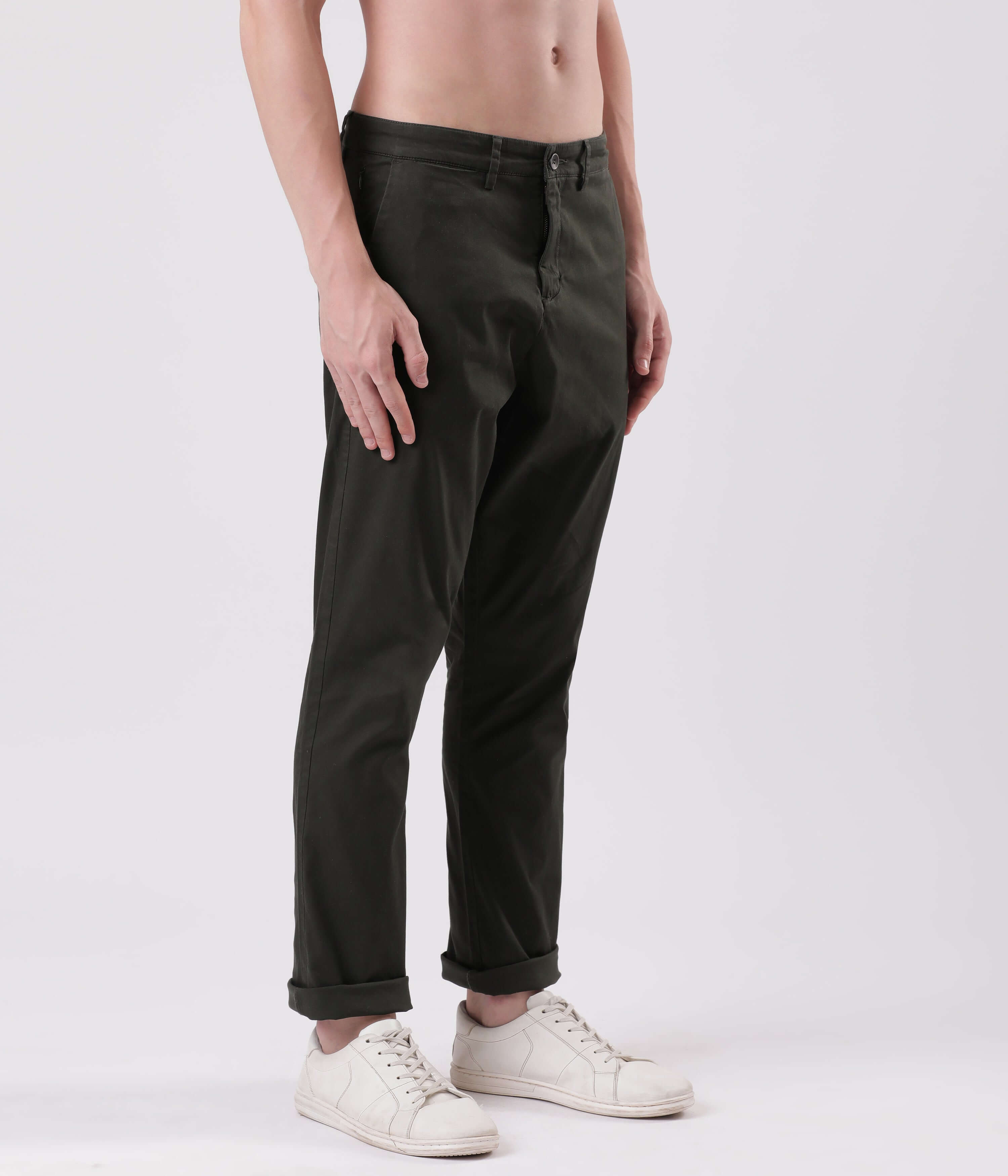 Turms Sage Olive Chino showcased on model, featuring stretchable cotton fabric and rolled cuffs for style and comfort.