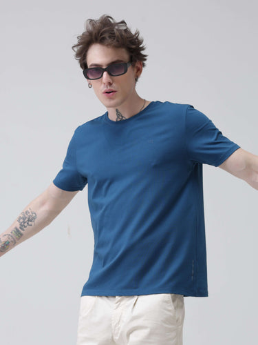 Man wearing a Sea Blue round-neck Turms T-shirt, tailored fit, 95% premium cotton, ideal for stylish and stain-resistant mens tshirts online.