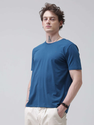 Man wearing Sea Blue round neck Turms T-shirt, branded stylish stain-proof and odor-resistant casual wear for men.