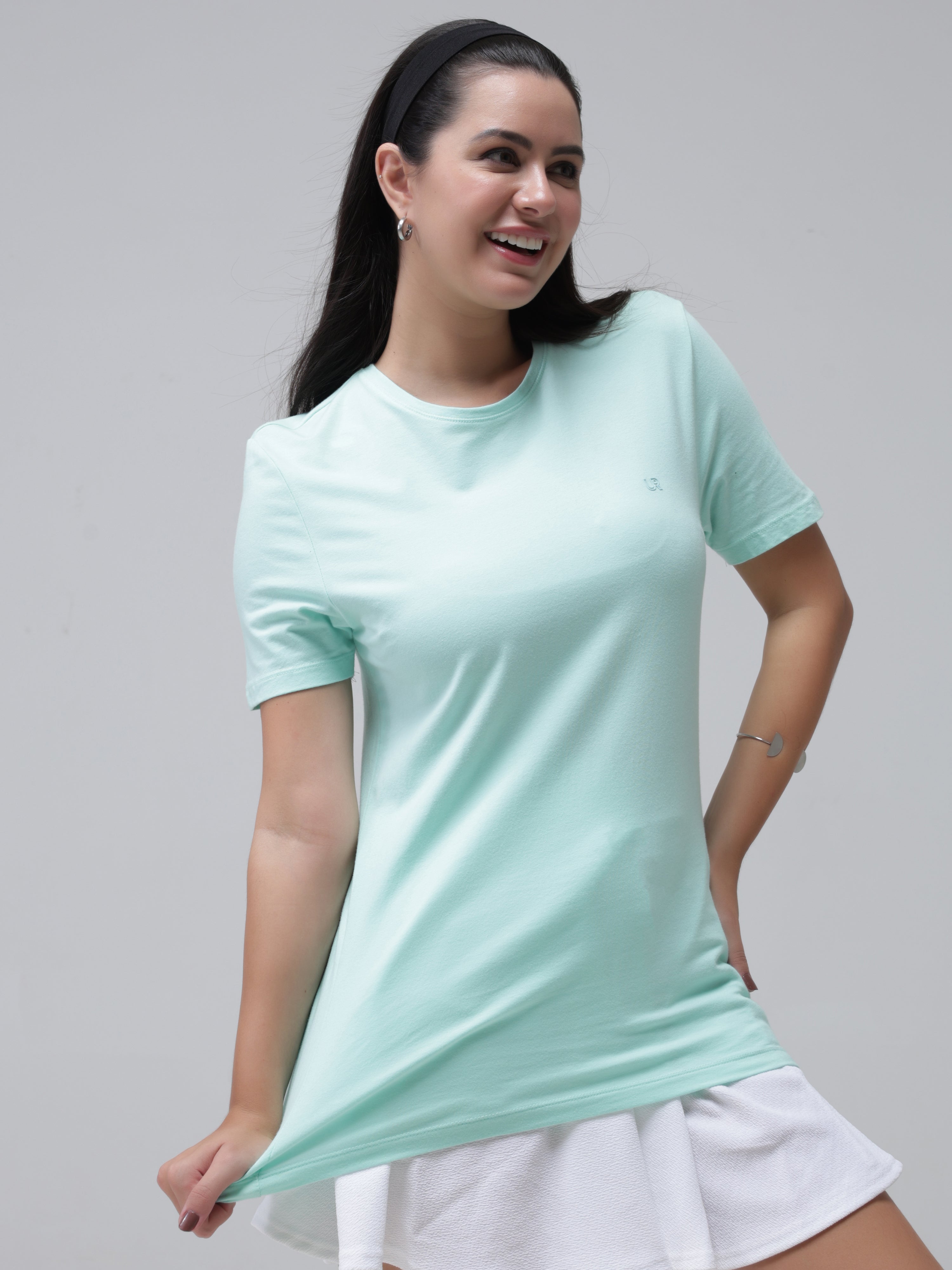 Woman wearing a stylish round-neck Aquamarine Turms T-shirt made from 95% premium cotton and 5% spandex, stain-proof and odor-resistant.