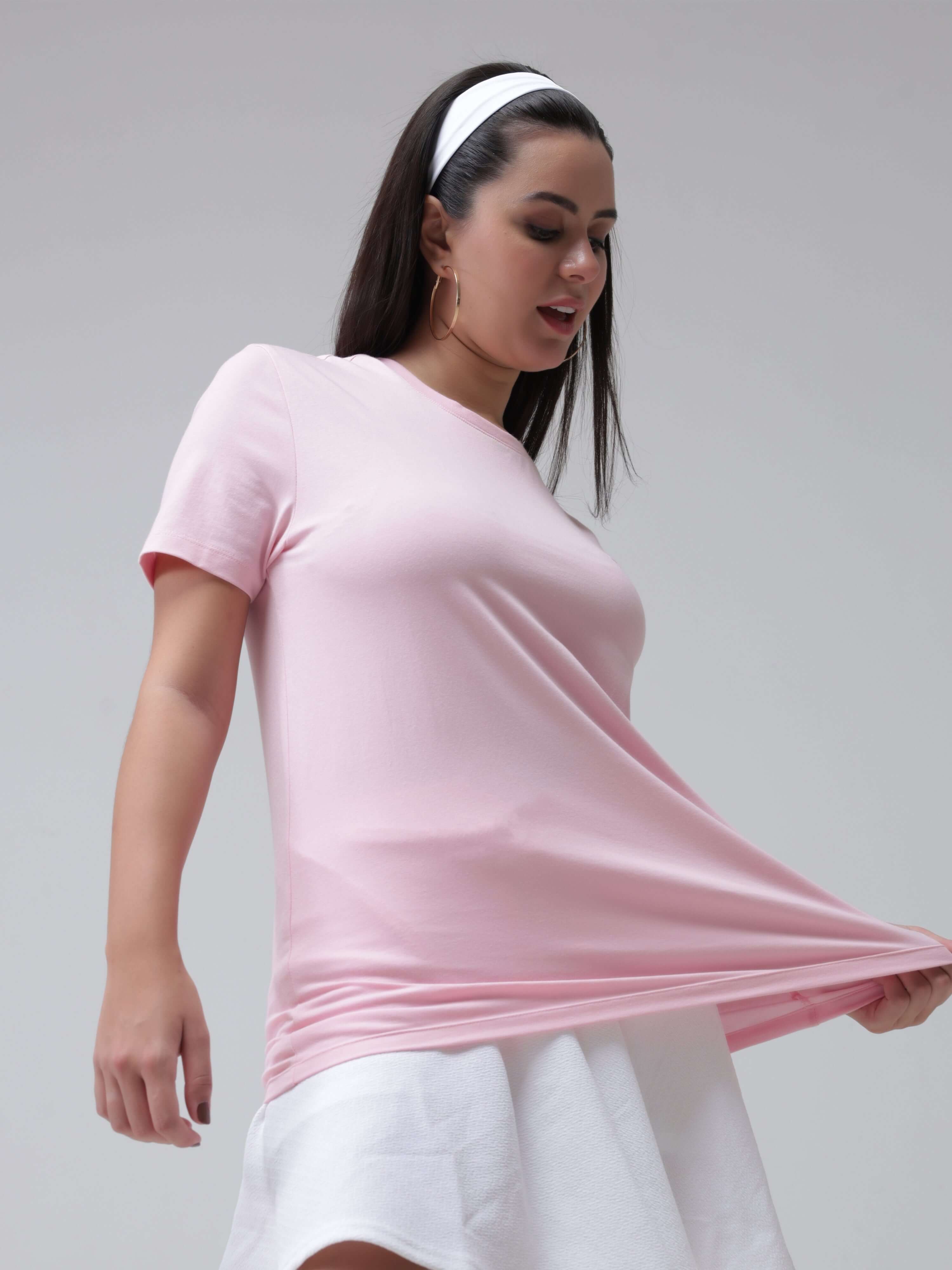 Woman wearing pink round-neck Turms T-shirt; anti stain, anti odour, stretchable intelligent apparel for women, trending best t-shirts.