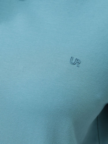 Light blue round-neck Turms T-shirt detail closeup with UR logo, water-resistant and stain-proof, stylish and trendy apparel for men